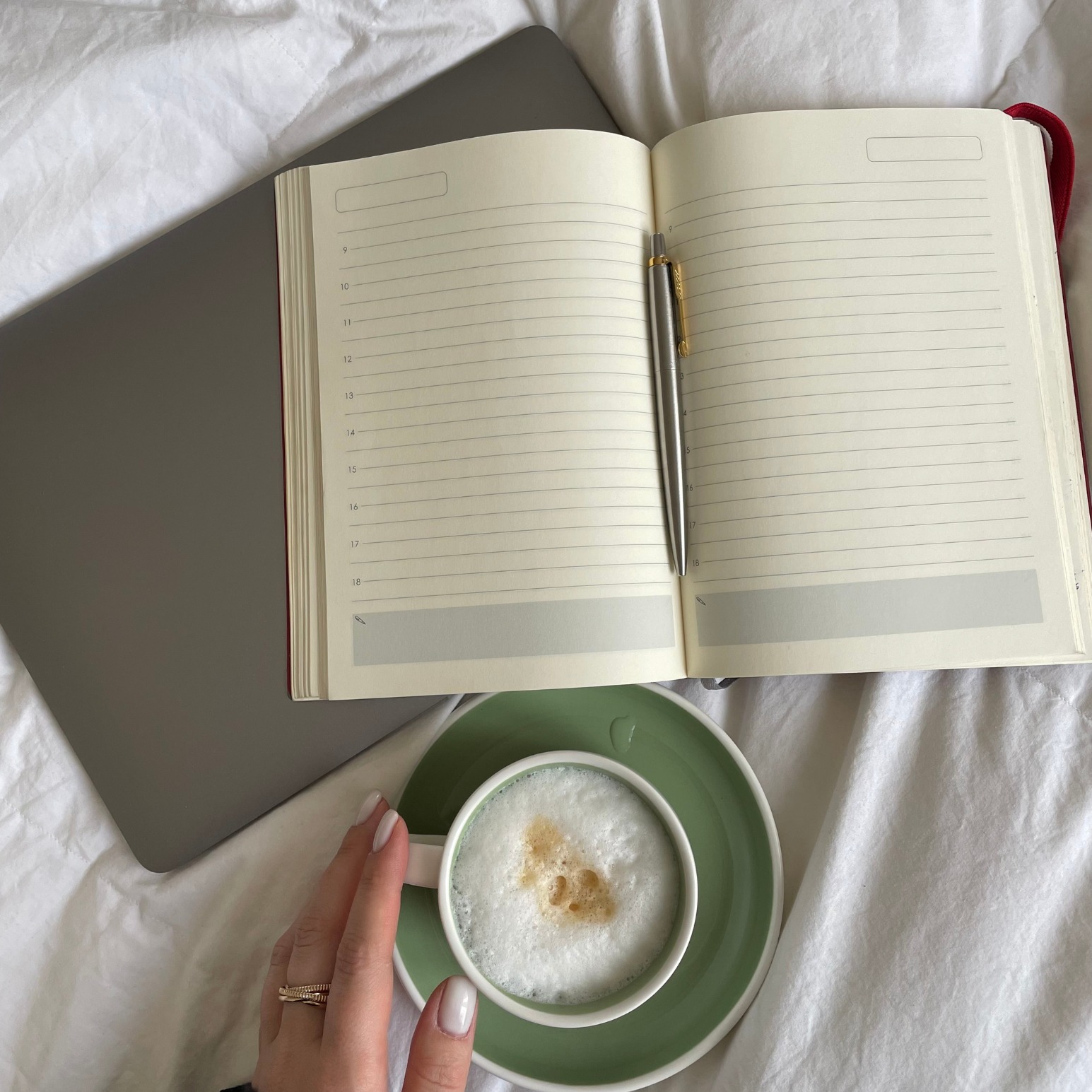 An open journal, laptop and cup of coffee, faith-integrated counseling in Katy, Texas